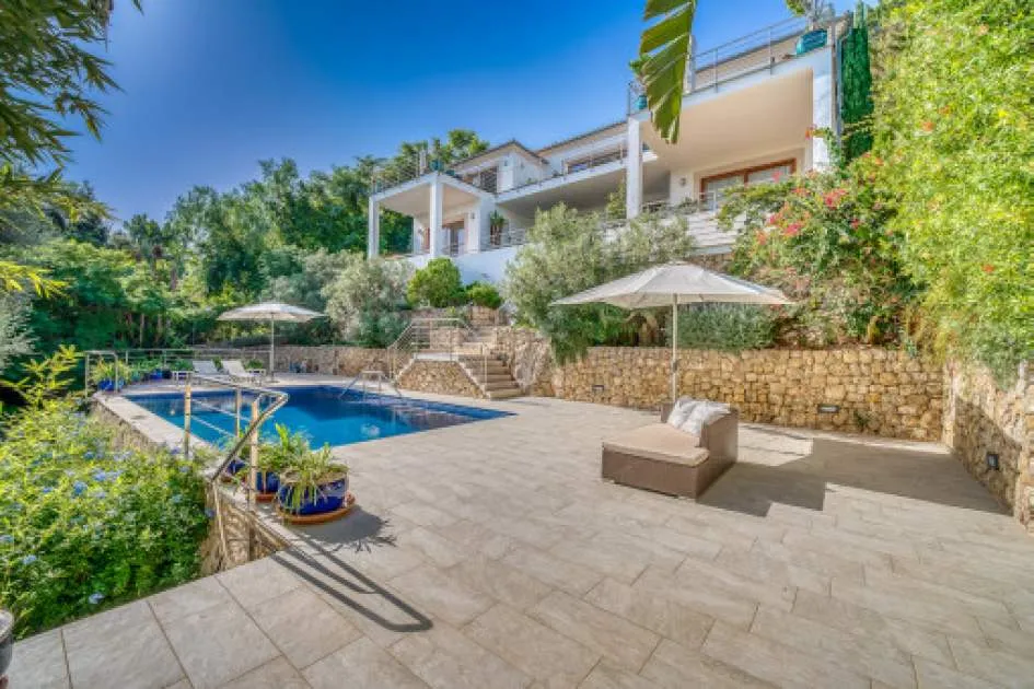 Smashing villa with pool and sea views located on a slope in luxurious part of Port de Pollensa