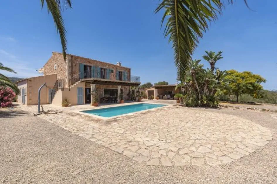 Enchanting natural-stone finca with heated pool and sea views in S'Espinagar