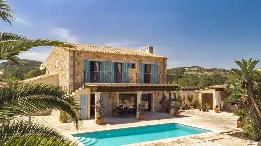 Enchanting natural-stone finca with heated pool and sea views in S'Espinagar