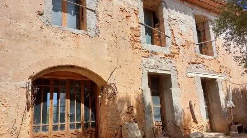 Rustic finca building plot with a stone house requiring restoration in Consell