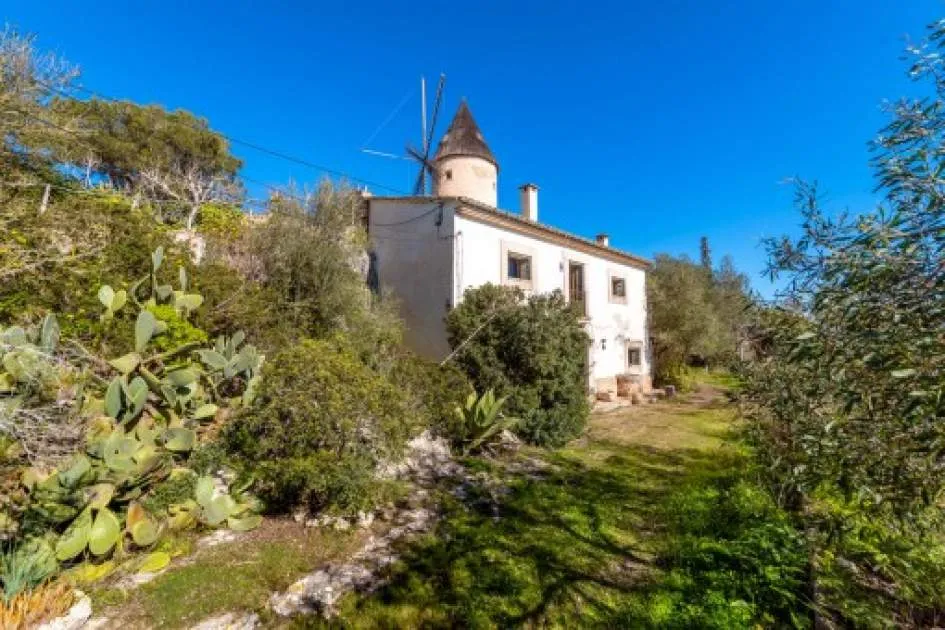 Unique village-house with mill tower, large garden and sweeping views in Santa Eugenia