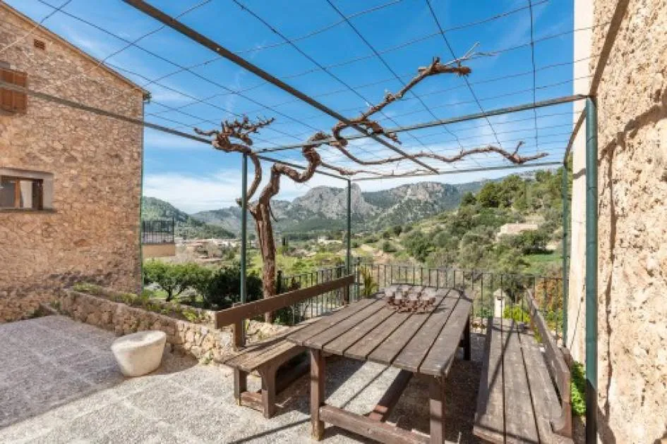 Two Mallorcan houses with typical stone facades and spectacular panoramic views in Bunyola