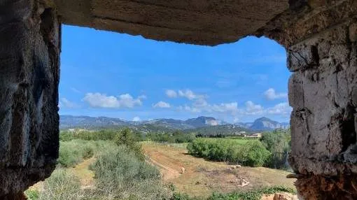 Rustic finca building plot with a stone house requiring restoration in Consell