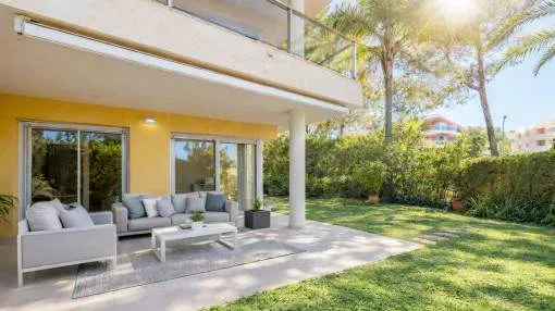 Exclusive ground floor apartment with private garden, two parking spaces, and communal pool in Sol de Mallorca