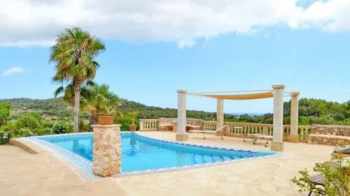 Mediterranean finca with three guest apartments, pool and beautiful views of the sea near Es Carritxo