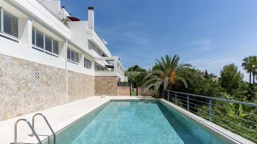 Spacious family apartment with sea views, private garden and communal pool in Cas Catala