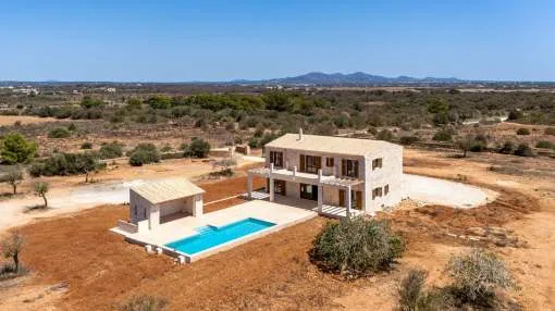Exclusive newly built finca with pool and stunning sea views between Es Llombards and Exclusive newly built finca with pool and stunning sea views between Es Llombards and